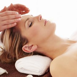 Woman Getting a Reiki treatment